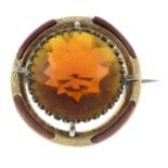 A late 19th century Scottish 9ct gold and silver, paste and carnelian brooch.Diameter 3.9cms.