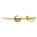 An early 20th century 15ct gold sabre sword brooch,