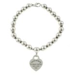 A silver 'Return to Tiffany' heart tag bead bracelet, by Tiffany & Co.Signed Tiffany & Co.