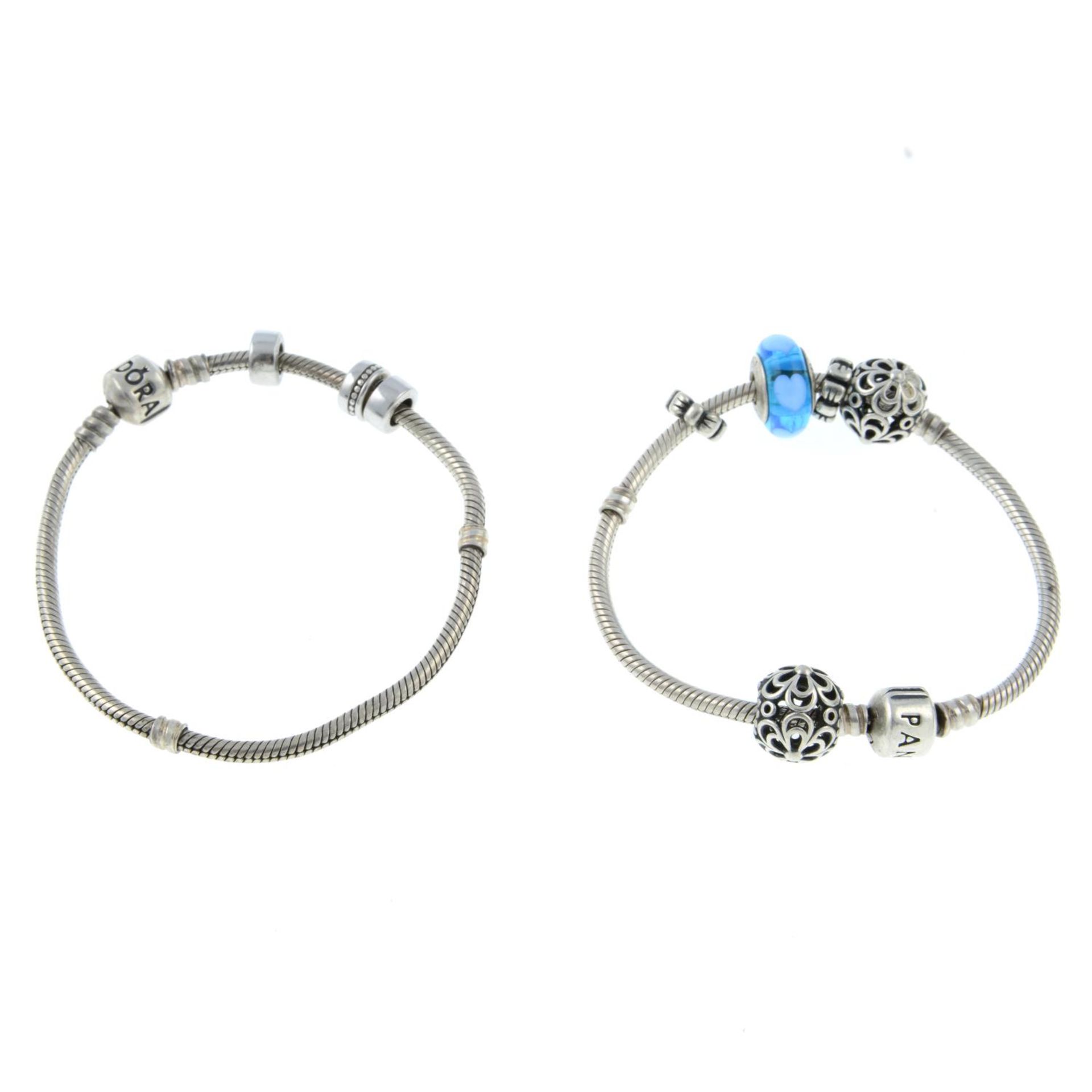 Two charm bracelets and eight charms, by Pandora.Both signed Pandora. - Image 2 of 2