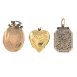 Three engraved lockets.Two stamped 9ct bk&ft.Lengths 2.8, 2.4 and 3.7cms.