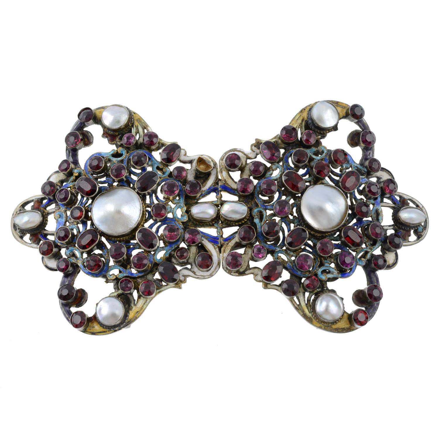 An Austro-Hungarian enamel, mabe pearl, garnet and vari-hue enamel buckle.AF.Length 11cms.