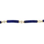 A lapis lazuli bracelet with Chinese character spacers.Stamped 14k, 575.Length 18.8cms.