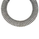 A Modernist ball-chain choker necklace.Length 38cms.