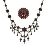 An early 20th century Bohemian garnet necklace and a rose-cut garnet brooch.Length of necklace