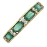 A 9ct gold emerald and colourless gem half eternity ring.