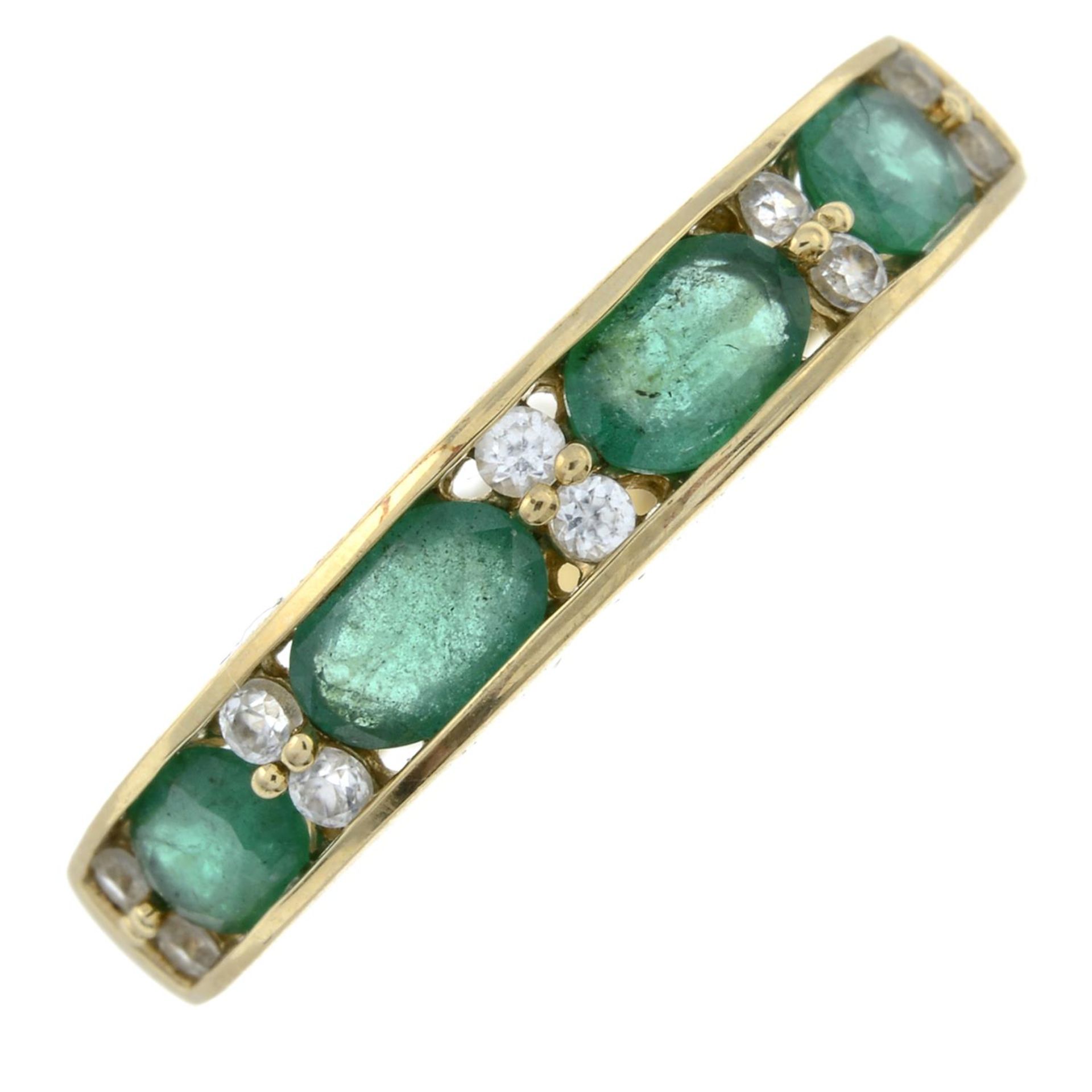 A 9ct gold emerald and colourless gem half eternity ring.