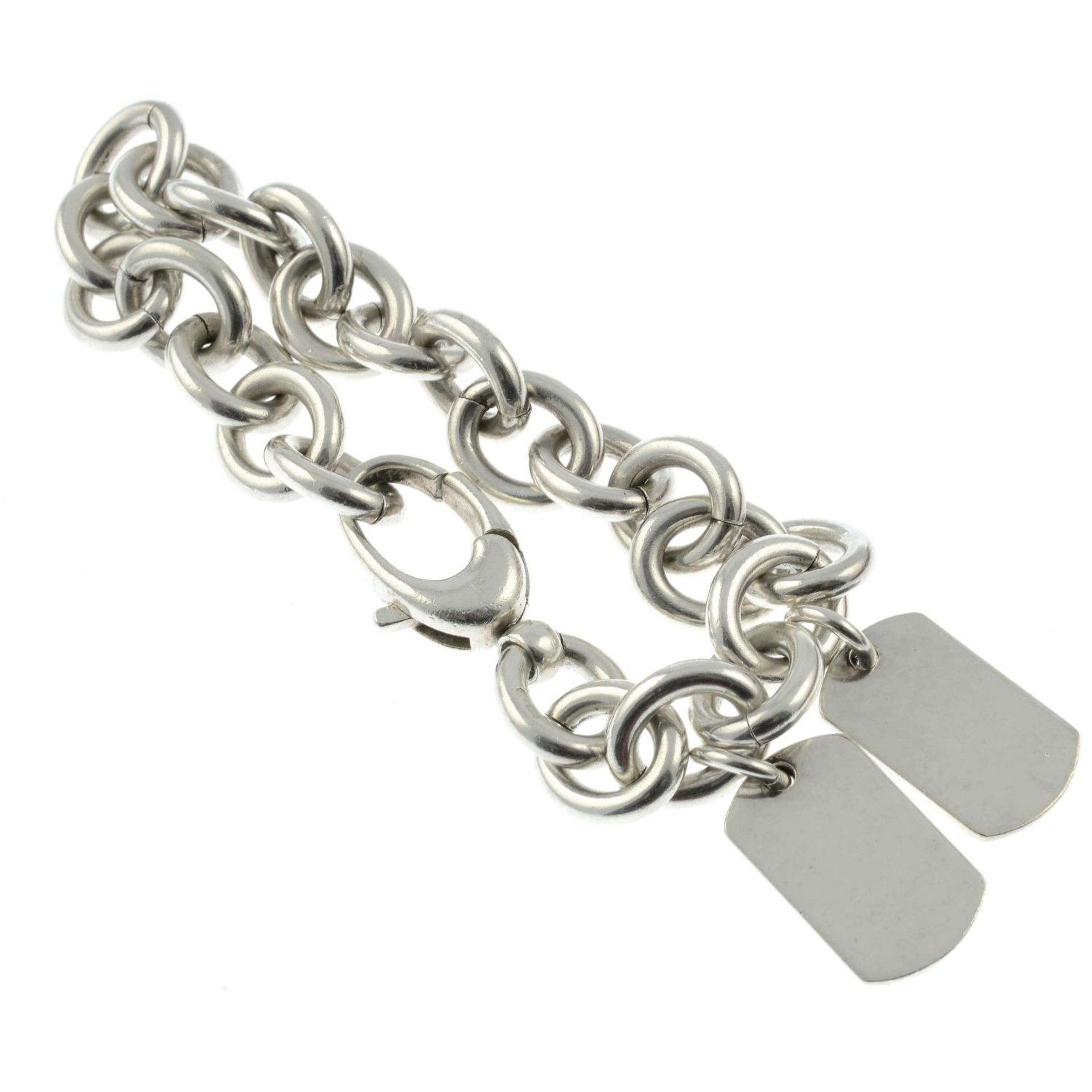 A silver bracelet with two tags charms, by Gucci.Signed Gucci. - Image 2 of 2
