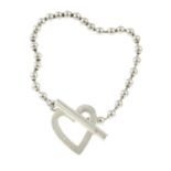 A silver heart T-bar bracelet, by Gucci.Signed Gucci.