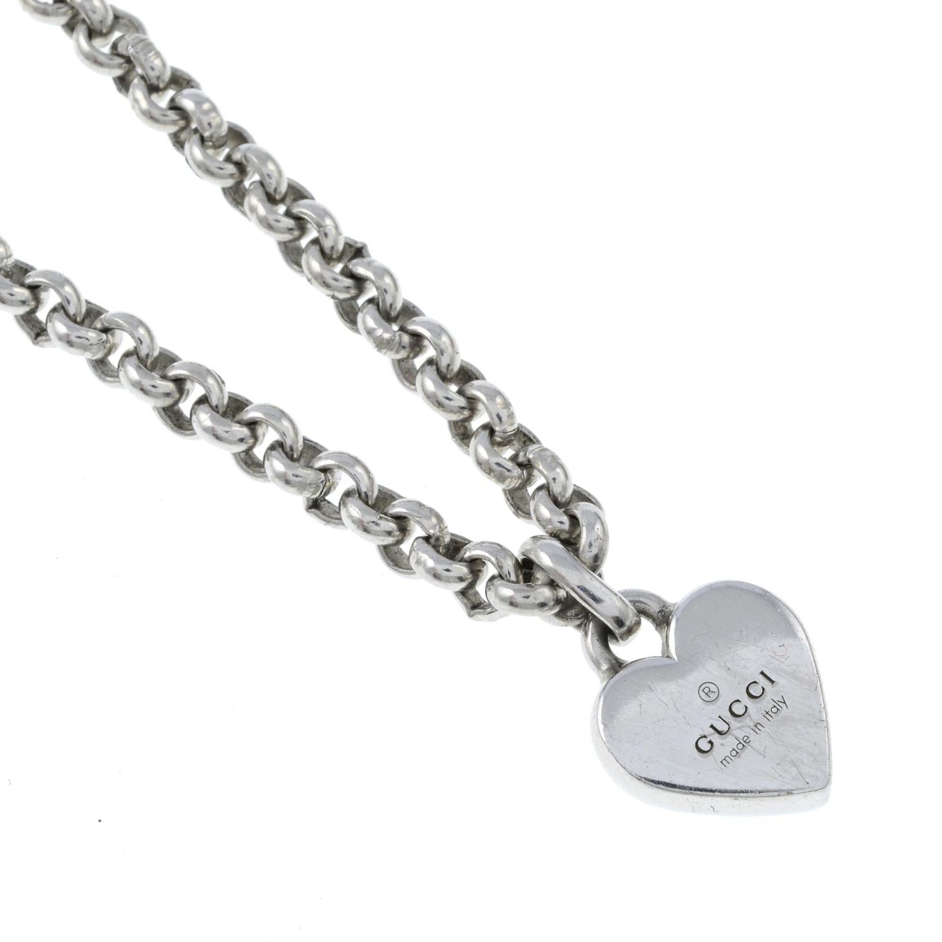 A silver 'Trademark' heart pendant with chain, by Gucci.Signed Gucci.Stamped 925.