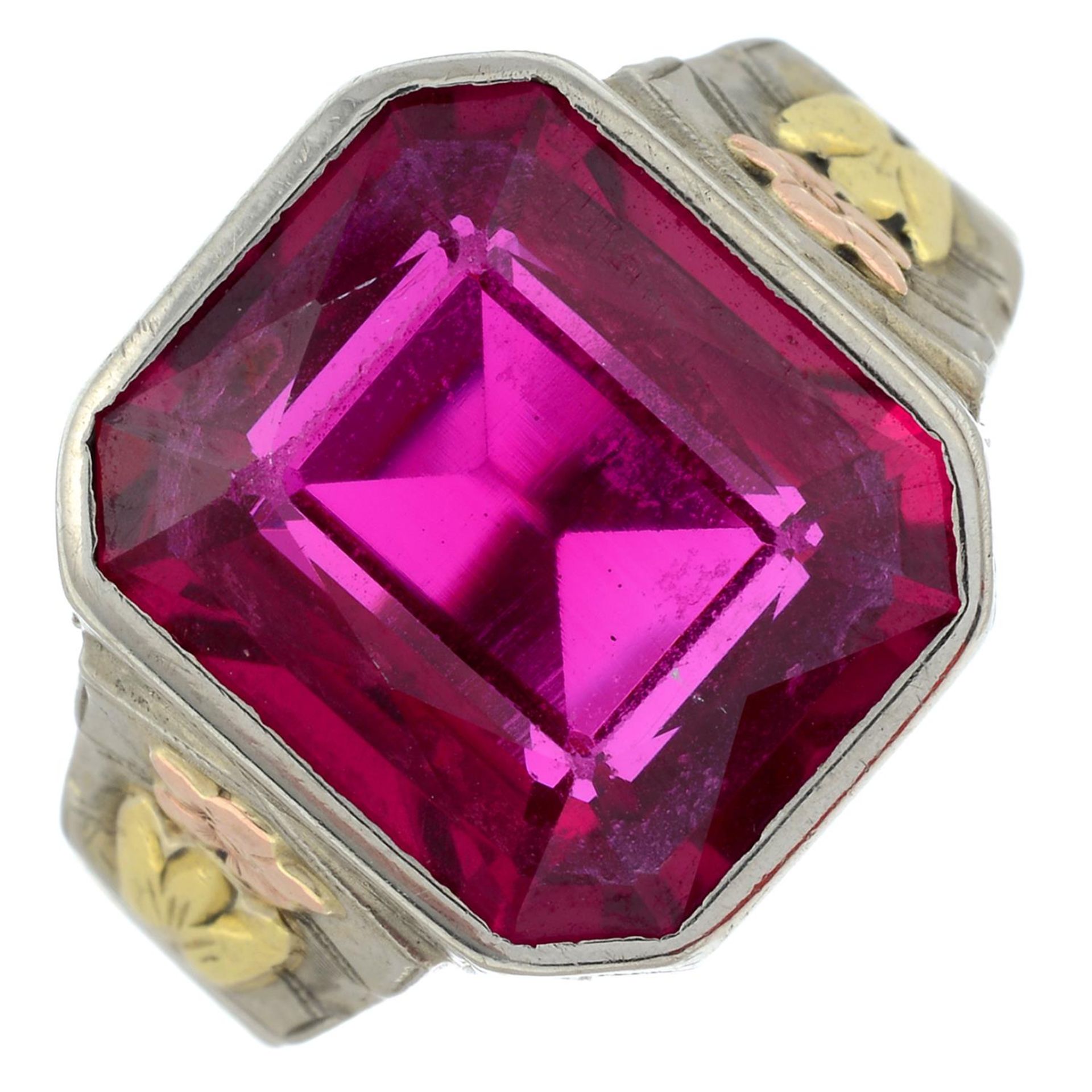 A synthetic ruby tri-colour ring.Stamped 10K.