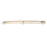 An early 20th century platinum and gold seed pearl bar brooch.Length 6.4cms.