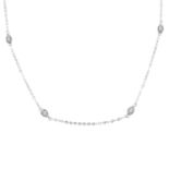 An 18ct gold two-row necklace, with diamond spacers.Total diamond weight 0.17ct.