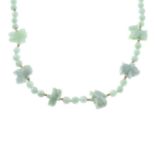 A jade single-strand necklace, with twelve carved Chinese zodiac signs spacers.Length 80cms.