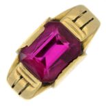 A synthetic ruby single-stone ring.Stamped 10K.