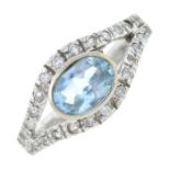 An aquamarine and cubic zirconia ring.Stamped 750.