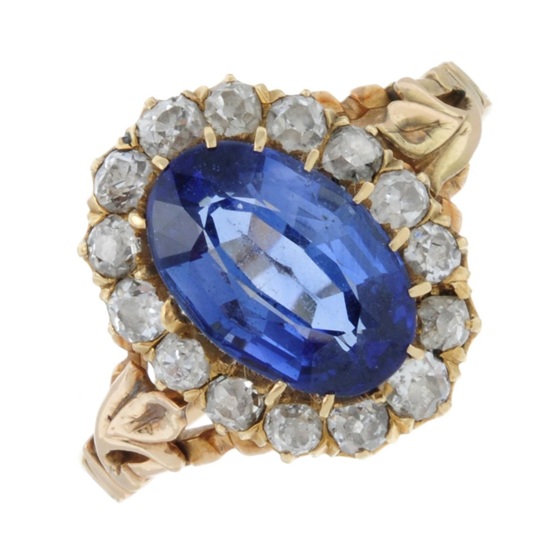 A synthetic sapphire and old-cut diamond cluster ring.Estimated total diamond weight 0.10ct.Stamped