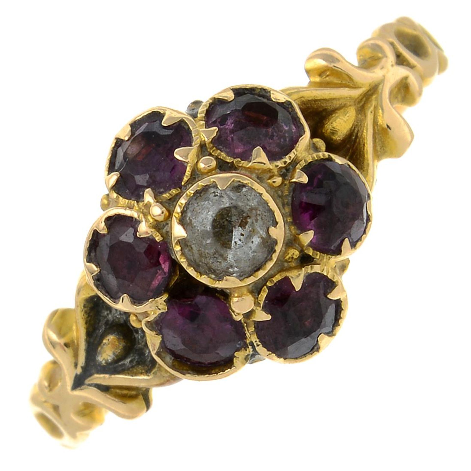 An early 20th century 15ct gold garnet and colourless paste cluster ring.Stamped 15.Ring size K.