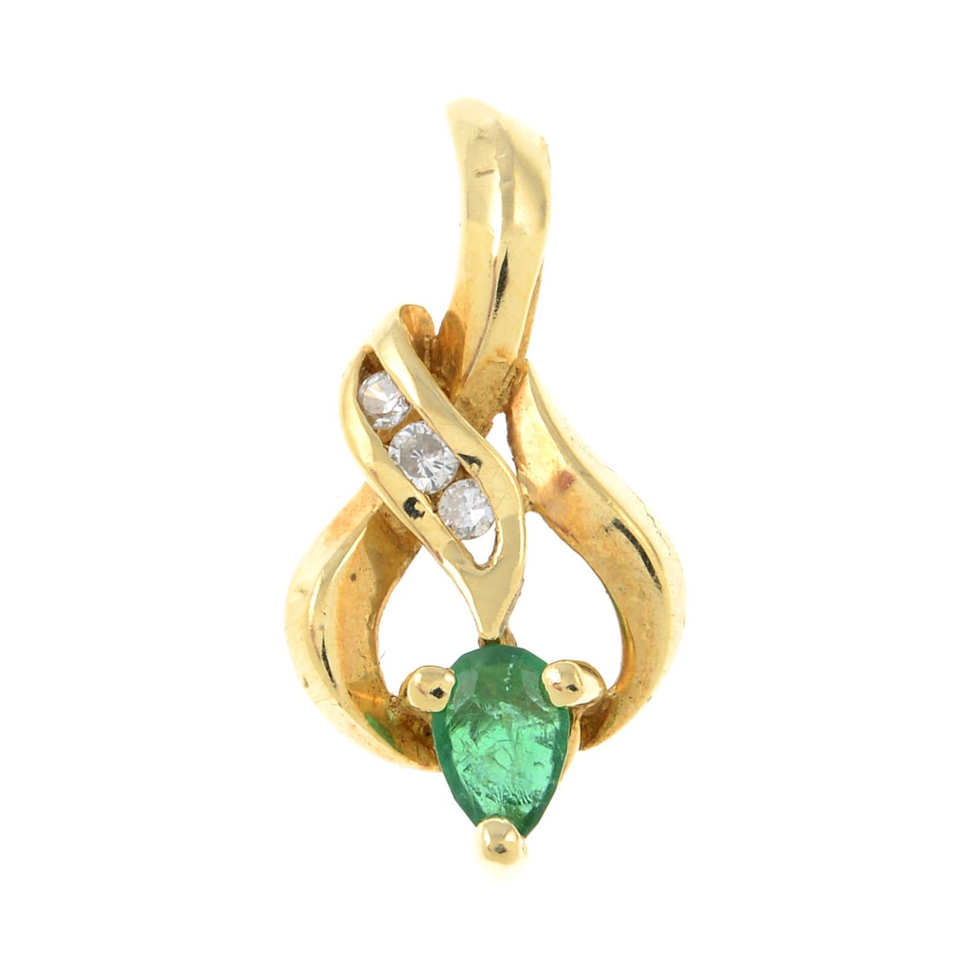 An emerald and diamond pendant.Stamped 14k.