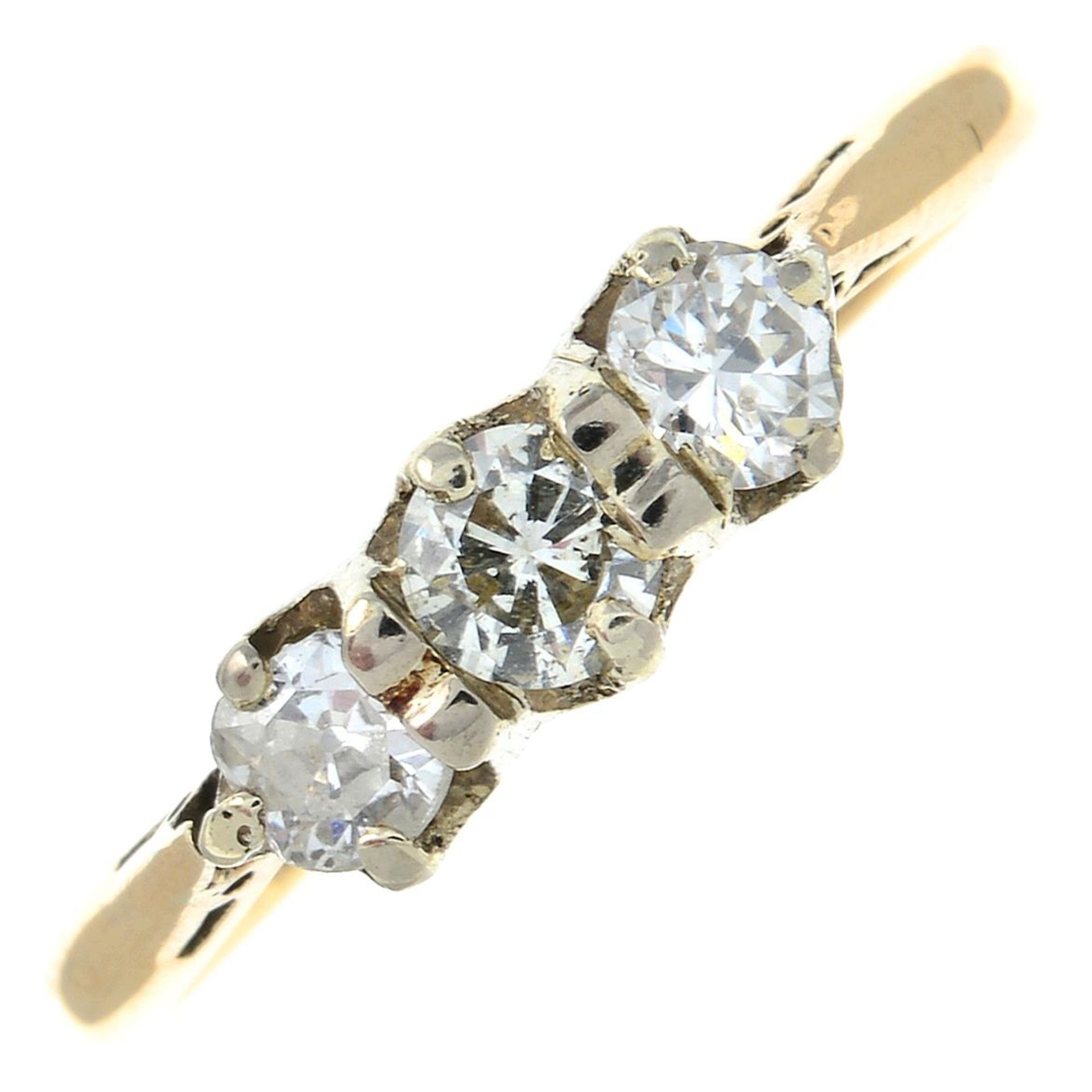 A brilliant and old-cut diamond three-stone ring.Estimated total diamond weight 0.35ct,