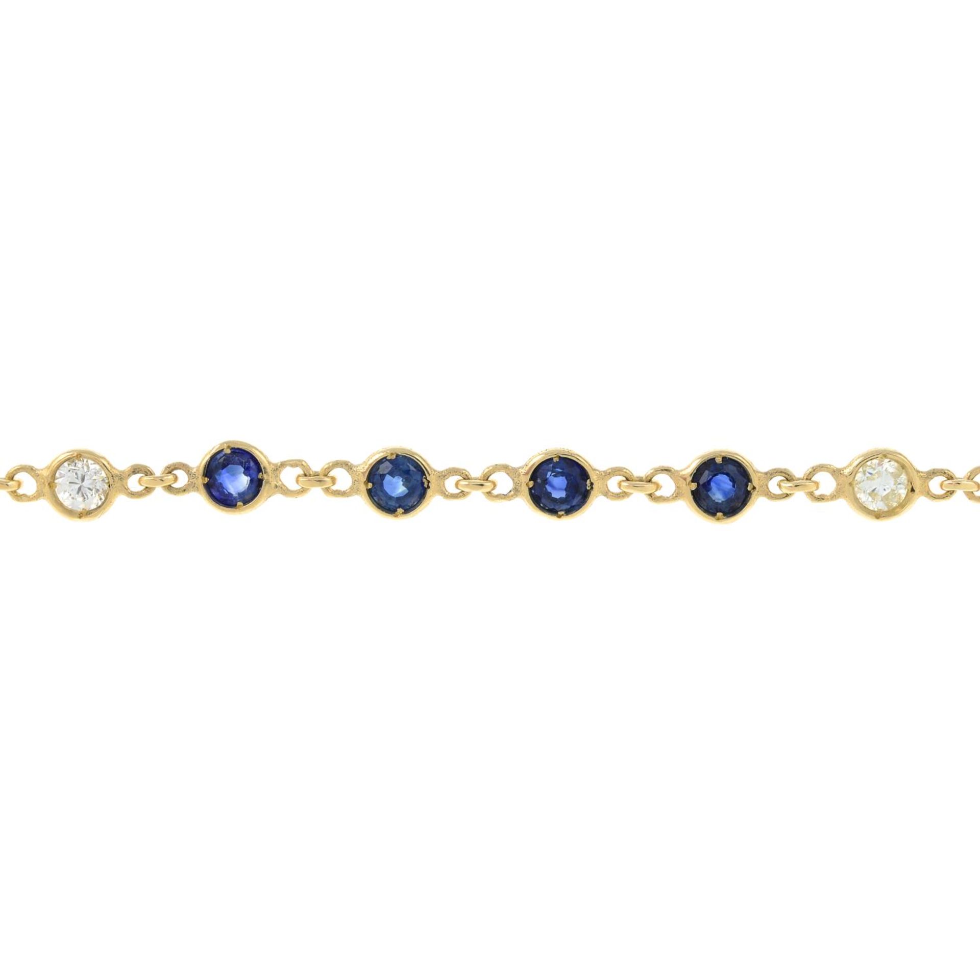 A sapphire and diamond line bracelet.Estimated total diamond weight 0.40ct.