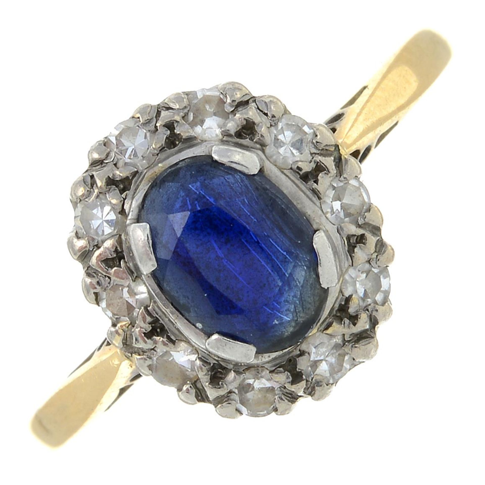 A sapphire and diamond cluster ring.Estimated total diamond weight 0.20ct.
