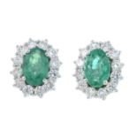 A pair of 18ct gold emerald and diamond cluster stud earrings.Total emerald weight 0.76ct.