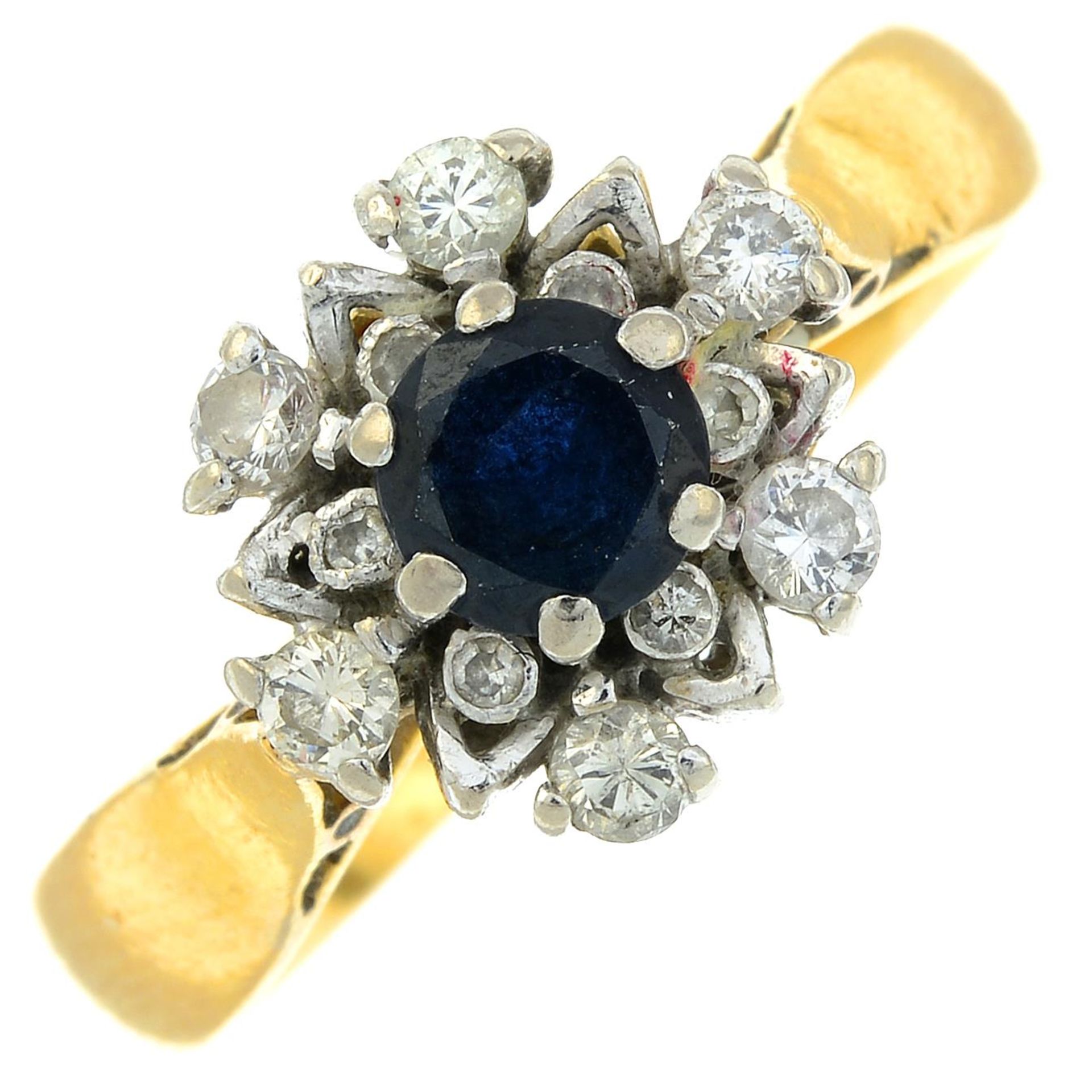 An early 20th century 22ct gold sapphire and vari-cut diamond cluster ring.Estimated total diamond