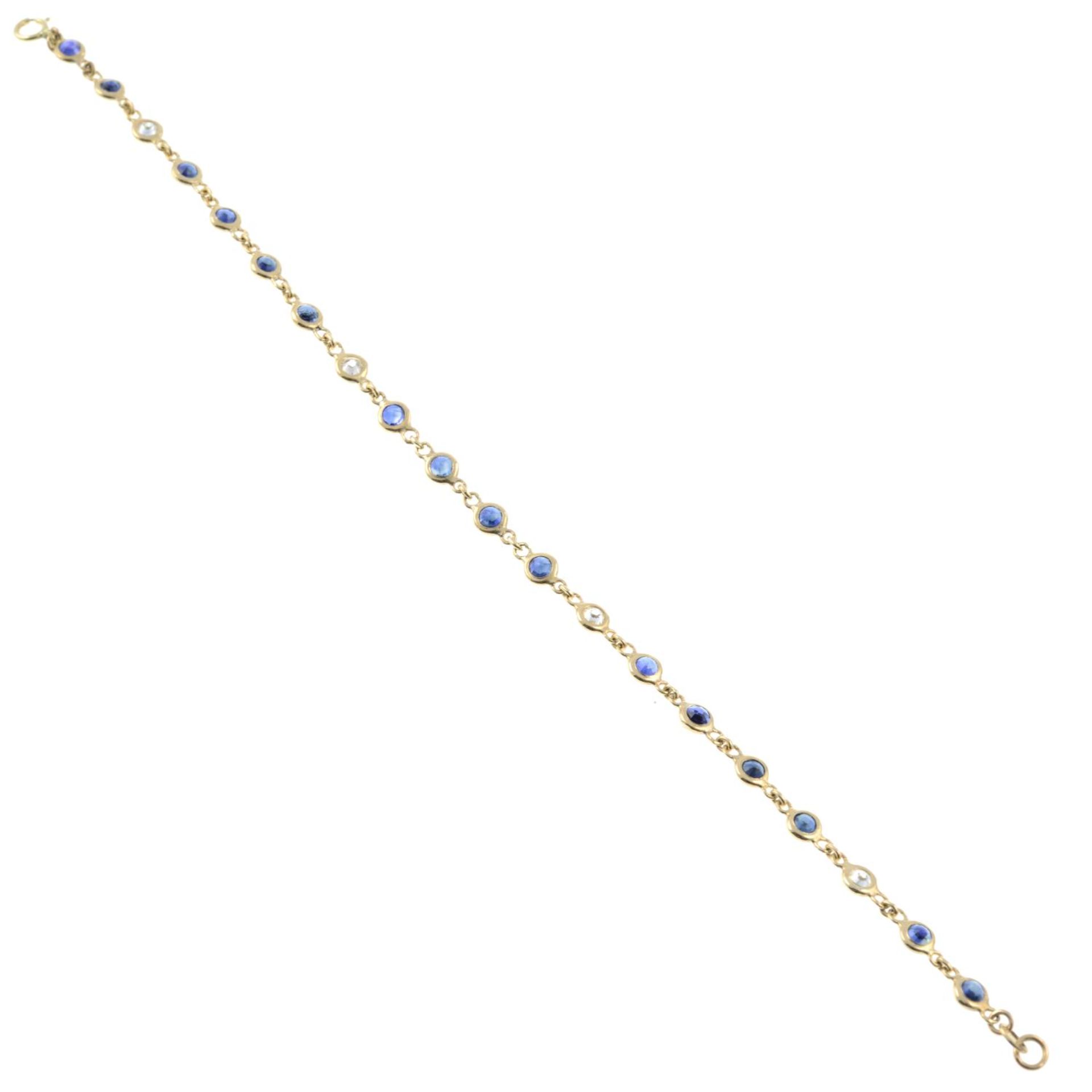 A sapphire and diamond line bracelet.Estimated total diamond weight 0.40ct. - Bild 2 aus 2