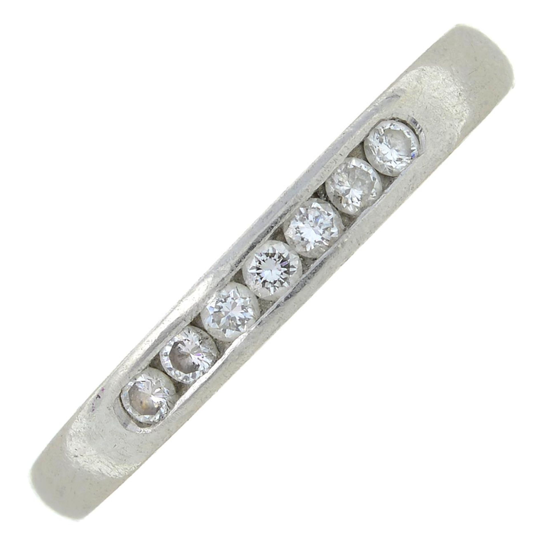 A platinum diamond half eternity ring.Estimated total diamond weight 0.15ct.
