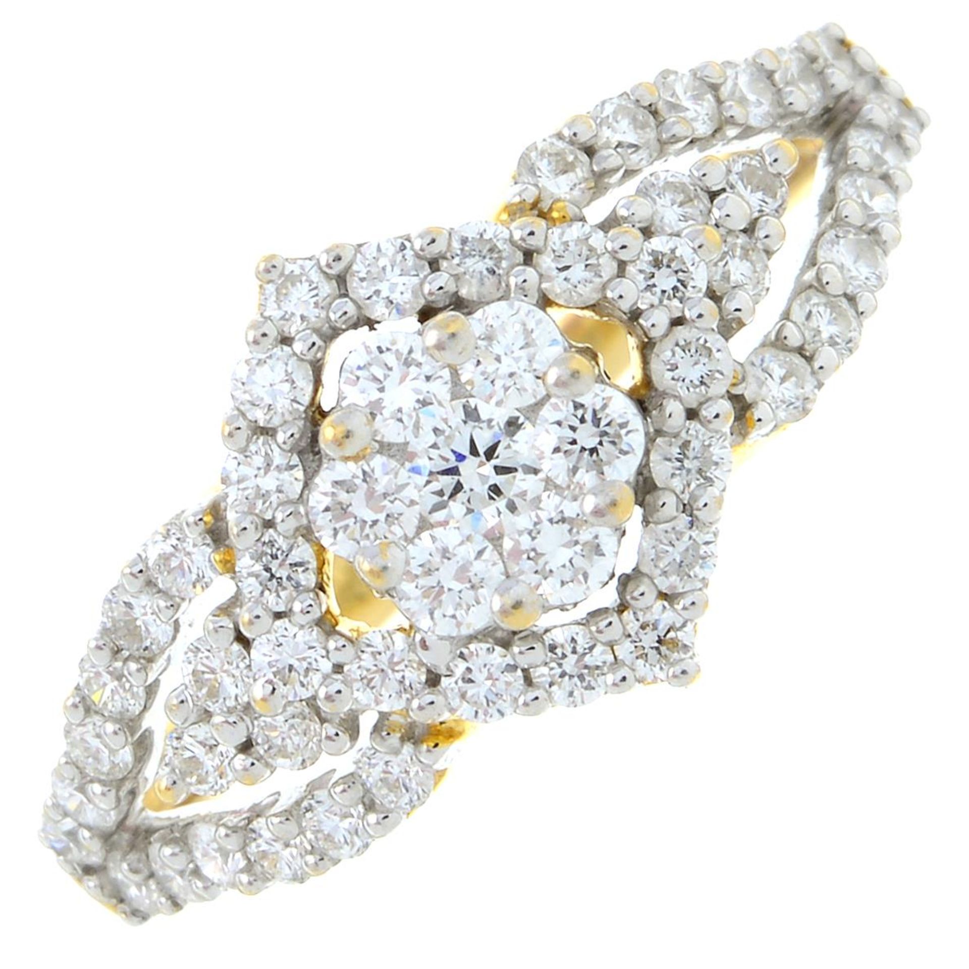 A brilliant-cut diamond dress ring.Estimated total diamond weight 0.65ct.Stamped 18K.Ring size L.