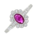 An 18ct gold ruby and diamond cluster ring.Ruby weight 0.41ct.