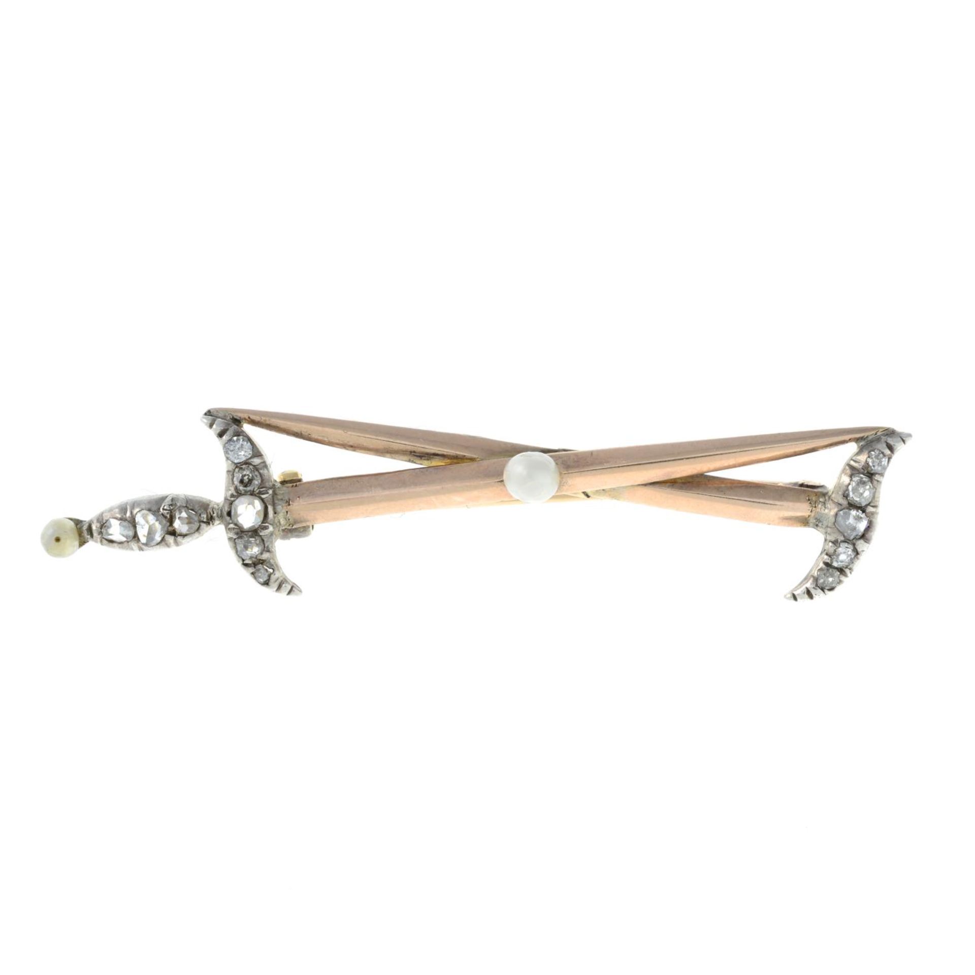 A rose-cut diamond and seed pearl brooch, designed to depict two swords.