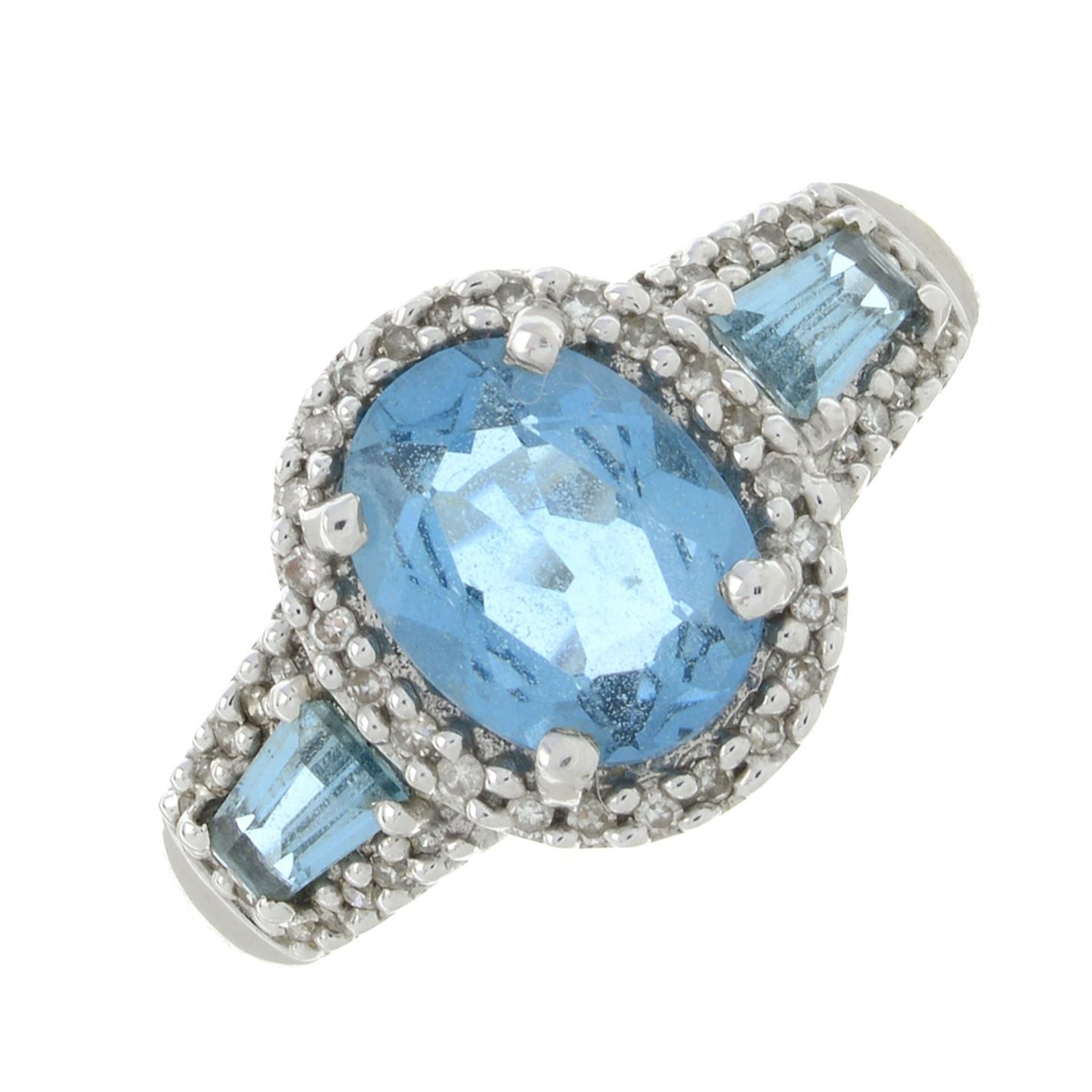 A 9ct gold blue topaz and diamond ring.Estimated total diamond weight 0.20ct.