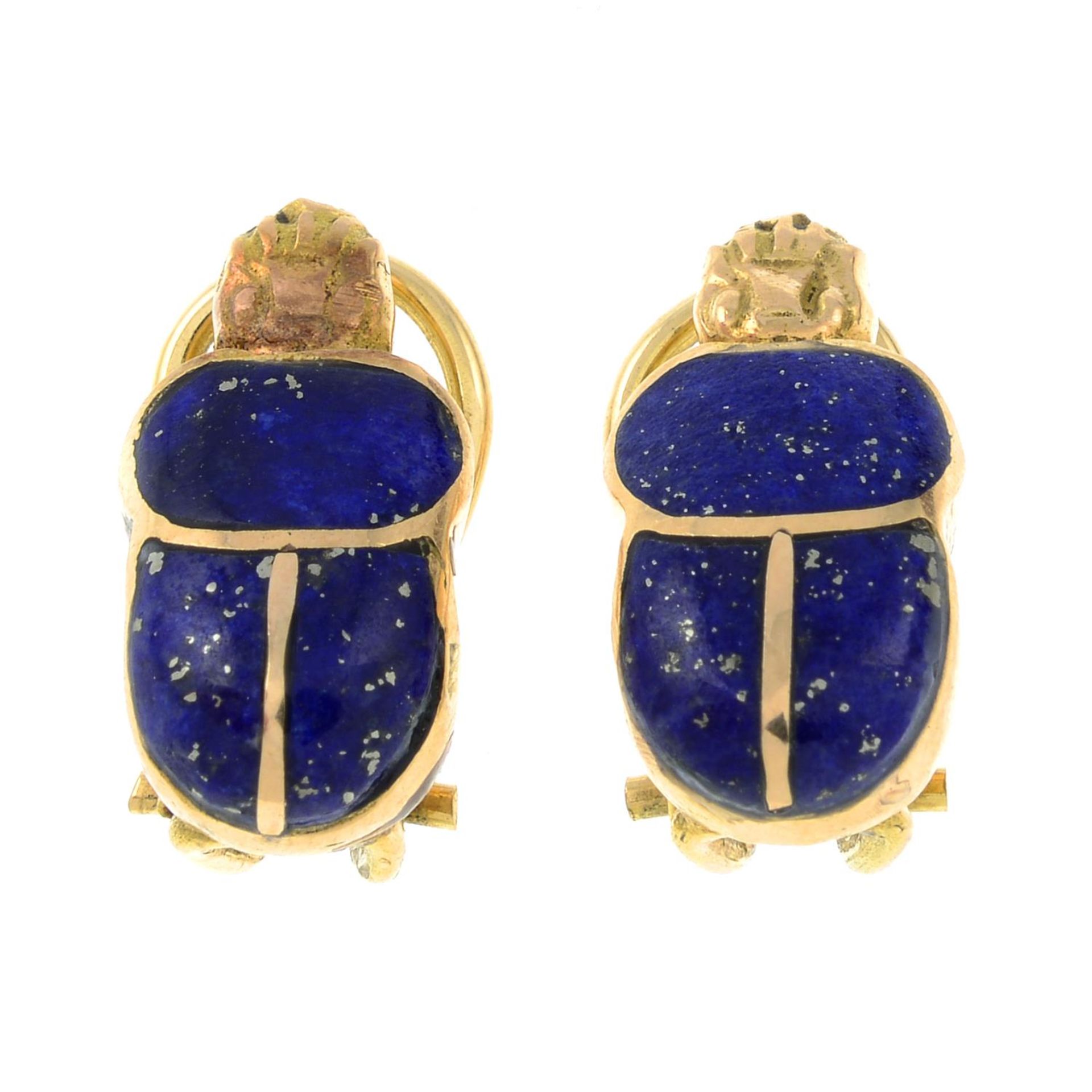 A pair of lapis lazuli earrings, each designed to depict a scarab beetle.Egyptian marks.