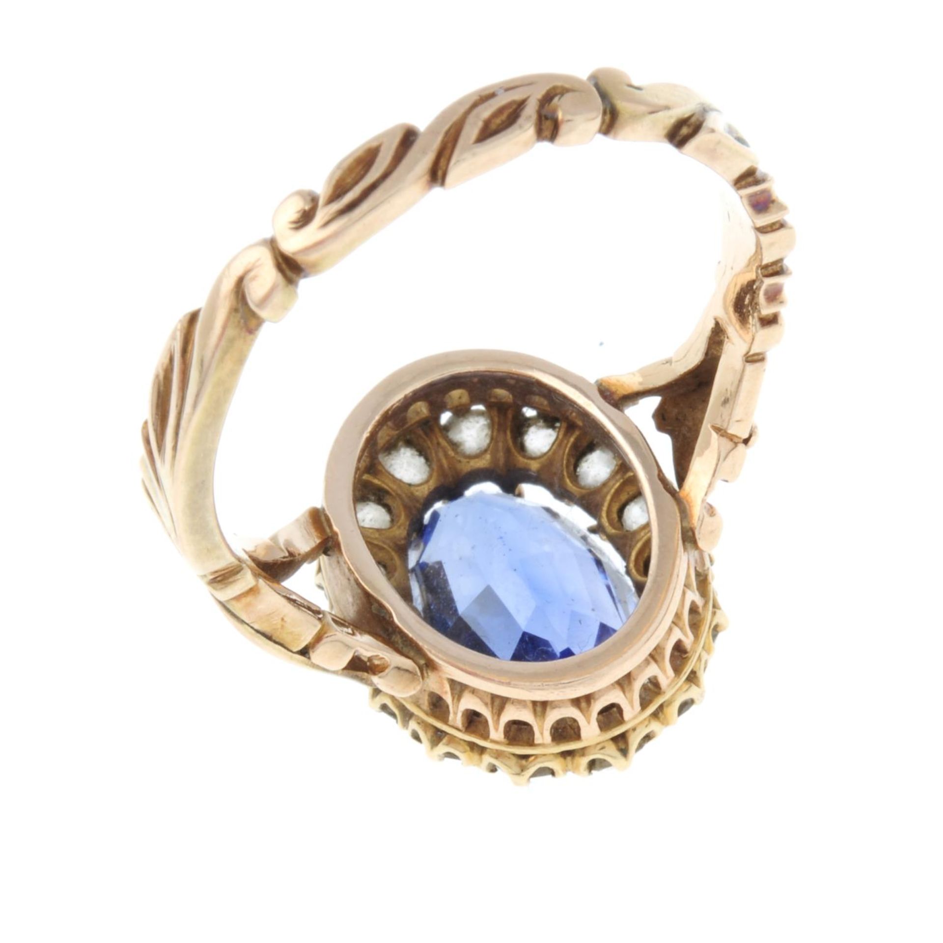 A synthetic sapphire and old-cut diamond cluster ring.Estimated total diamond weight 0.10ct.Stamped - Image 3 of 3