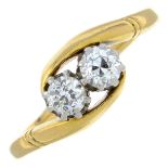 A circular-cut diamond two-stone ring.Estimated total diamond weight 0.30ct,