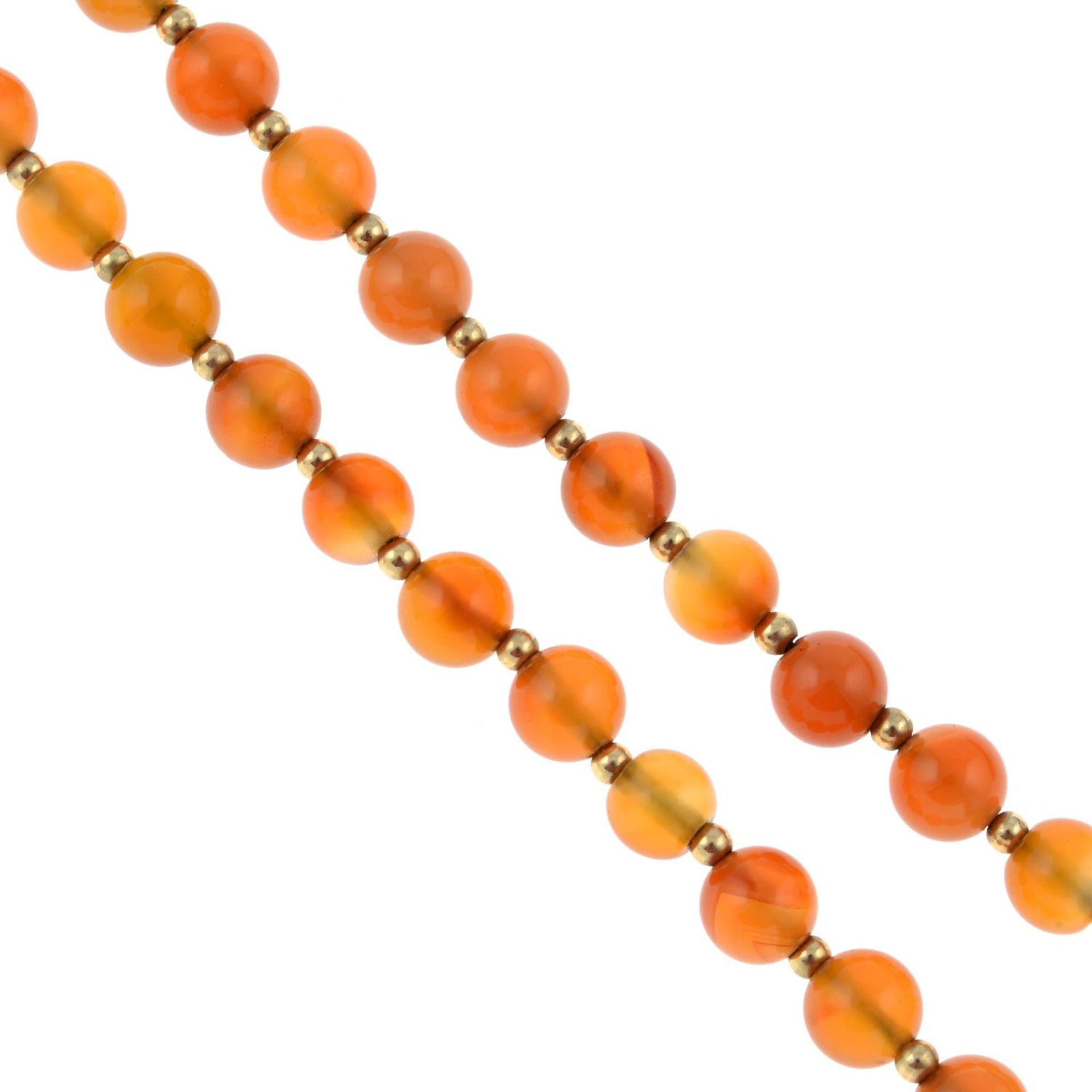 A carnelian bead single-strand necklace, with bead spacers.Clasp stamped 9K.Length 75cms.