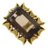 A smoky quartz dress ring.Smoky quartz calculated weight 34.79cts,