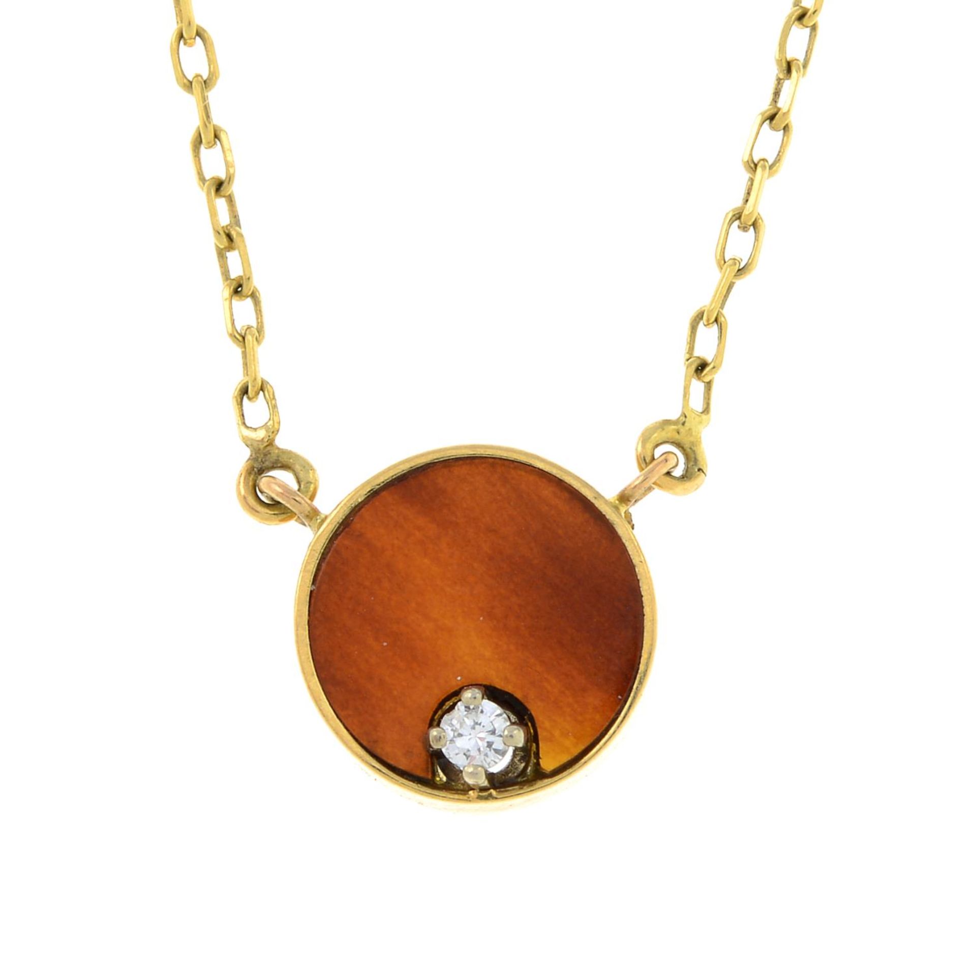 A carnelian and diamond pendant, on an integral trace-link chain.French assay marks.