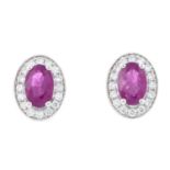 A pair of 18ct gold ruby and diamond earrings.Total ruby weight 1.24cts.