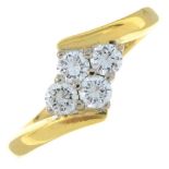 An 18ct gold brilliant-cut diamond four-stone crossover ring.Estimated total diamond weight 0.40ct.