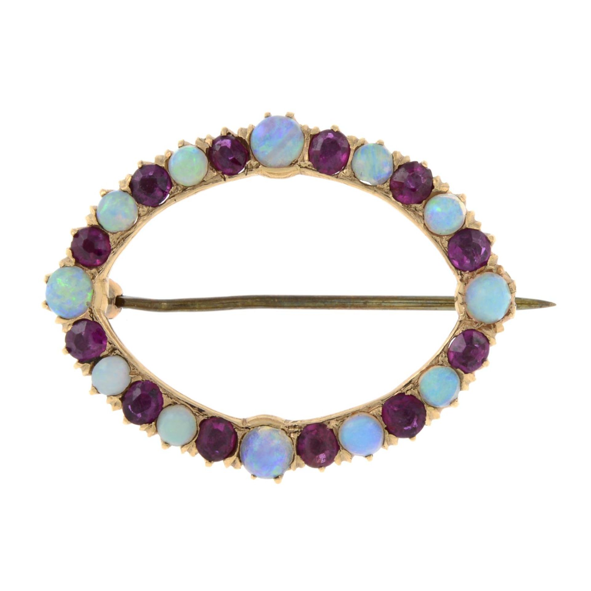 An opal and ruby wreath brooch.Length 3.1cms.