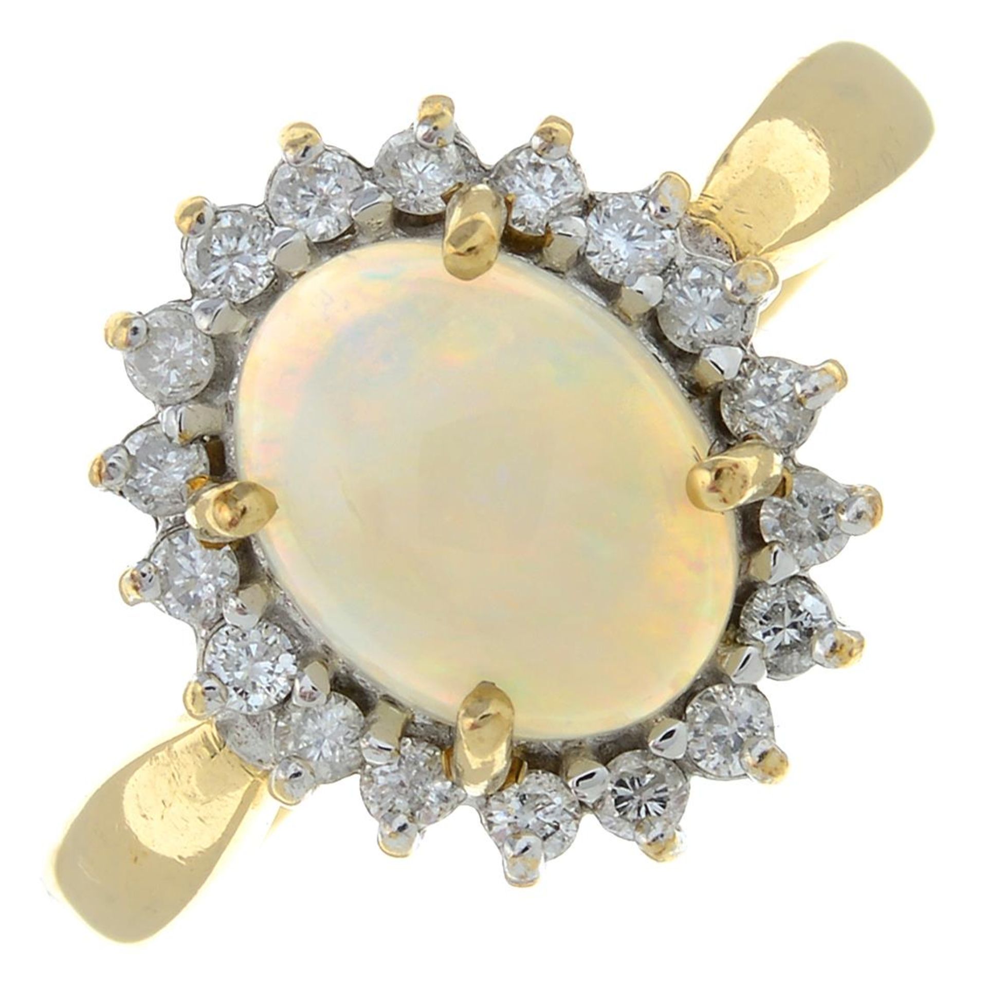 A 9ct gold opal and brilliant-cut diamond cluster ring.Estimated total diamond weight