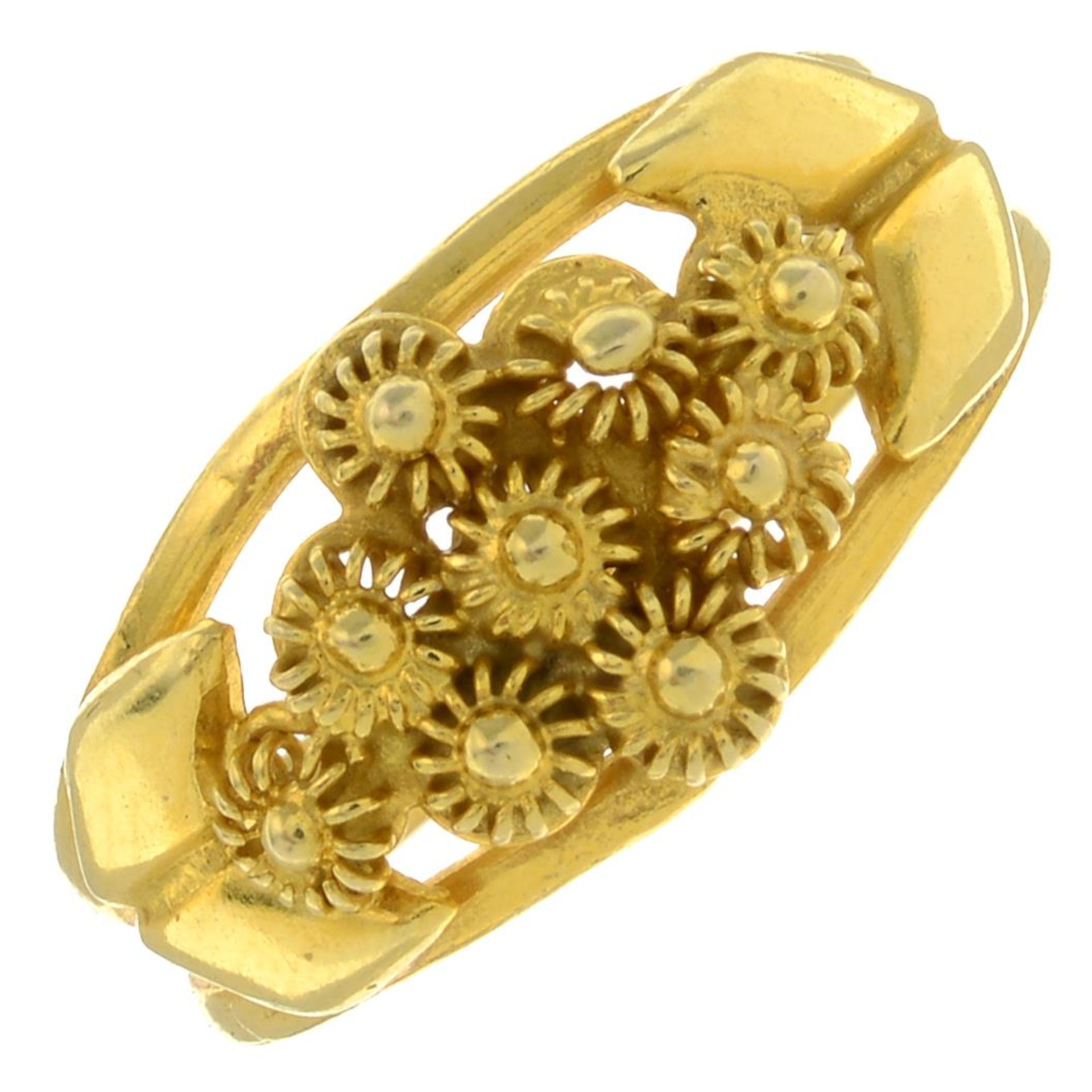 A floral ring.Stamped 750.Ring size O.