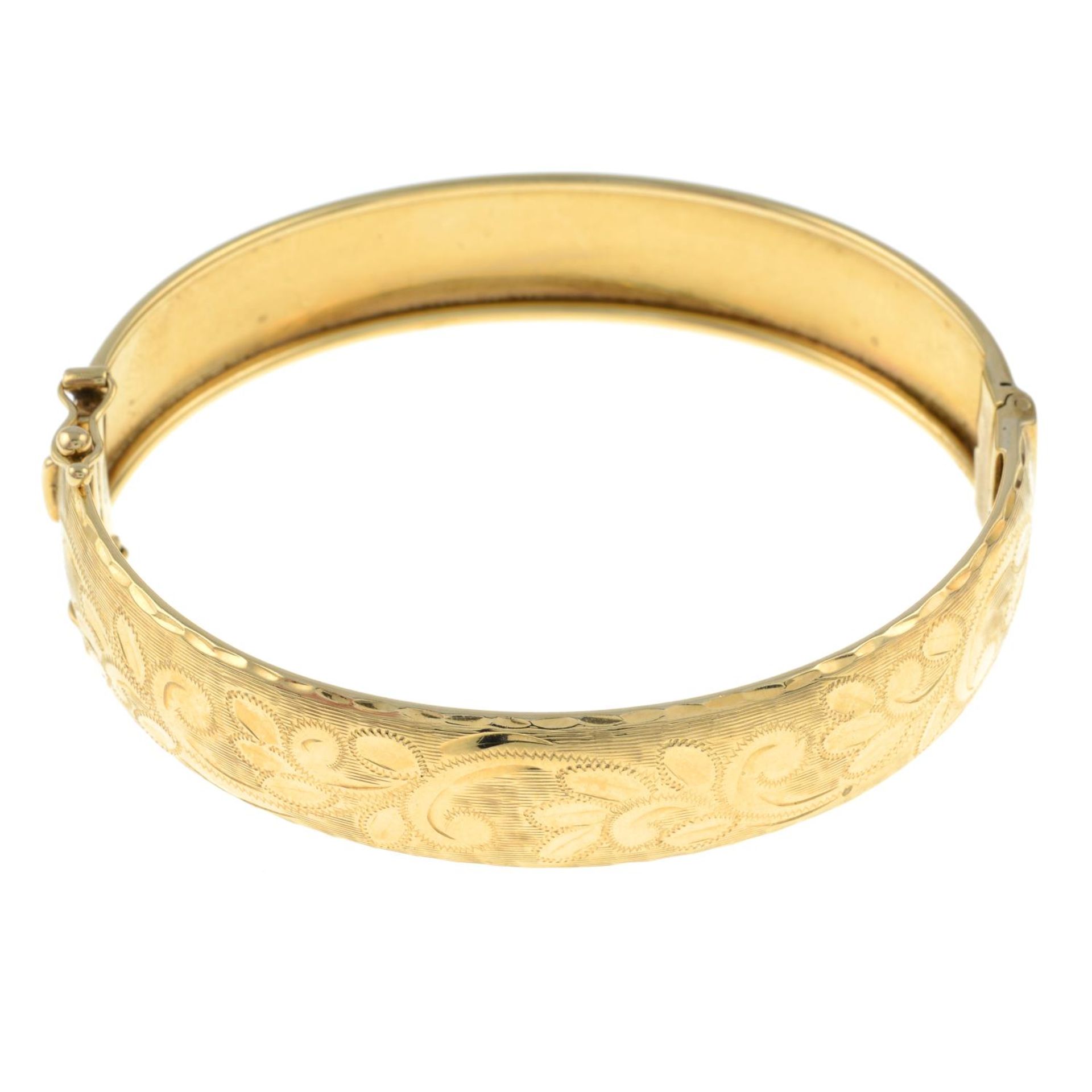 A 9ct gold engraved bangle.Hallmarks for London.