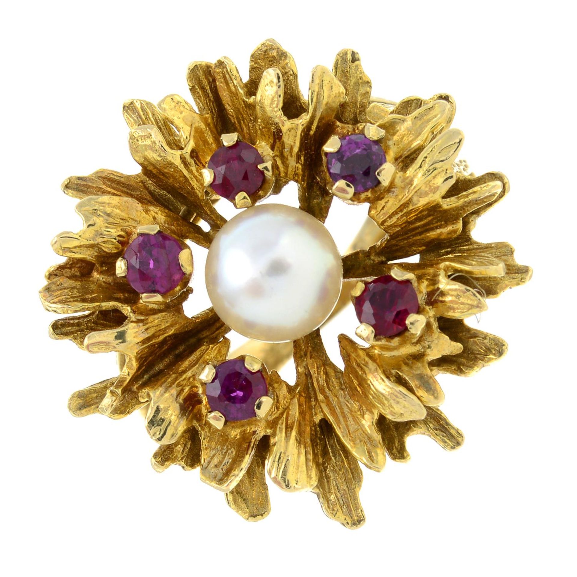 A 1960's 9ct gold cultured pearl and ruby abstract flower dress ring.Hallmarks for London, 1969.