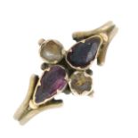 A late 19th century garnet and split pearl ring.