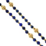 A lapis lazuli single-strand necklace, with grooved bead spacers.Clasp stamped 14K.