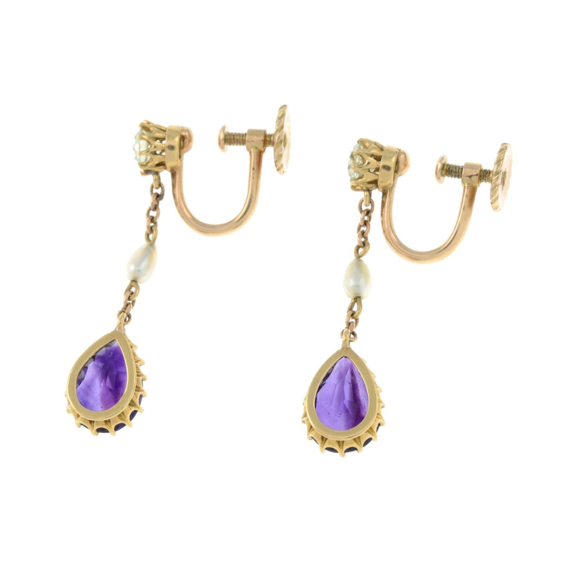 A pair of early 20th century gold amethyst, chrysoberyl and seed pearl earrings.Length 2.7cms. - Image 2 of 2